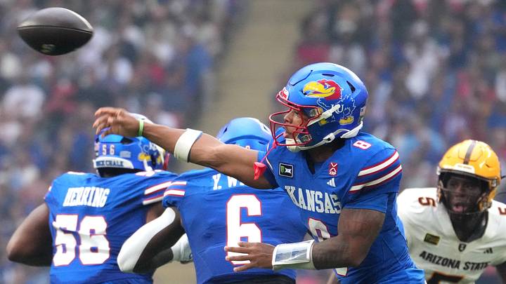 Sep 19, 2026; London, ENG; Kansas Jayhawks quarterback Isaiah Marshall (8) passes the ball against the Arizona State Sun Devils during the first quarter at Wembley Stadium. Mandatory Credit: Peter van den Berg-Imagn Images Sep 19, 2026; London, ENG; Kansas Jayhawks quarterback Isaiah Marshall (8) passes the ball against the Arizona State Sun Devils during the first quarter at Wembley Stadium. Mandatory Credit: Peter van den Berg-Imagn Images