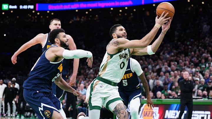 Jan 19, 2024; Boston, Massachusetts, USA; Boston Celtics forward Jayson Tatum (0) works for the ball