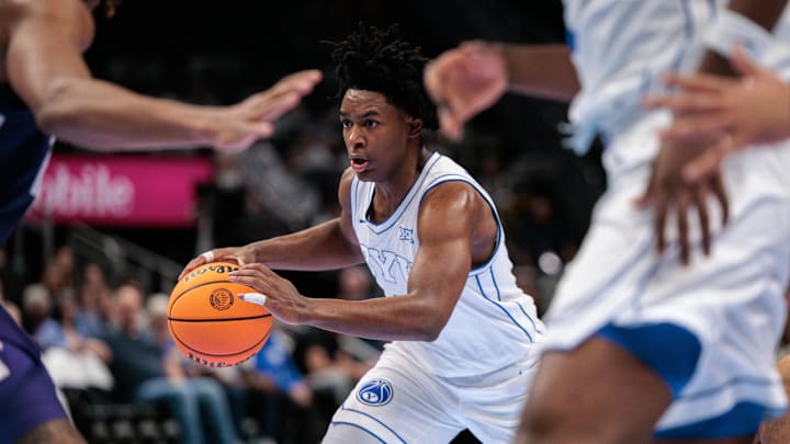 Mar 10, 2026; Kansas City, MO, USA; BYU Cougars guard Robert Wright III (1) brings the ball up court during the first half against the Kansas State Wildcats at T-Mobile Center. Mandatory Credit: William Purnell-Imagn Images