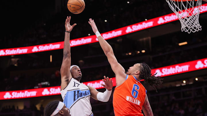Feb 28, 2025; Atlanta, Georgia, USA; Atlanta Hawks forward Onyeka Okongwu (17) shoots over Oklahoma City Thunder forward Jaylin Williams (6) in the third quarter at State Farm Arena. Mandatory Credit: Brett Davis-Imagn Images