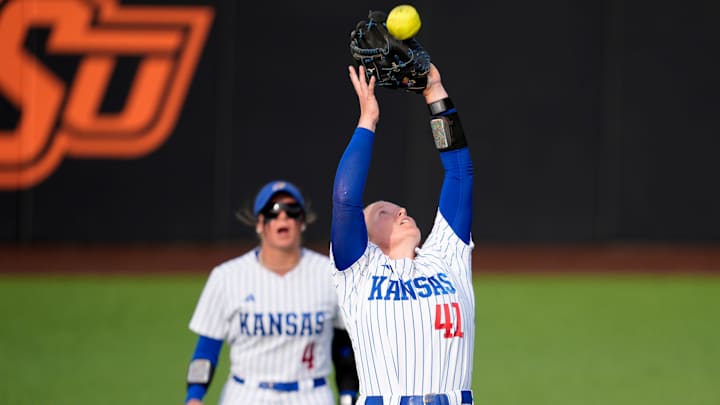 Kansas Jayhawks infielder Hailey Cripe (41) catches the ball for an out in the second inning of a college softball game between the Oklahoma State Cowgirls and the Kansas Jayhawks in Stillwater, Friday, May 1, 2026. Kansas Jayhawks infielder Hailey Cripe (41) catches the ball for an out in the second inning of a college softball game between the Oklahoma State Cowgirls and the Kansas Jayhawks in Stillwater, Friday, May 1, 2026.