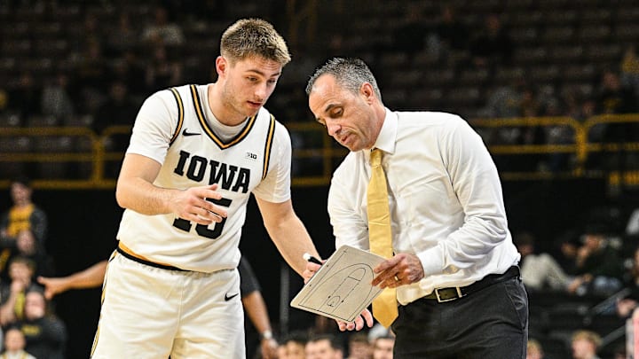 Nov 20, 2025; Iowa City, Iowa, USA; Iowa Hawkeyes head coach Ben McCollum reacts with guard Brendan Hausen (15) during the first half against the Chicago State Cougars at Carver-Hawkeye Arena. Mandatory Credit: Jeffrey Becker-Imagn Images