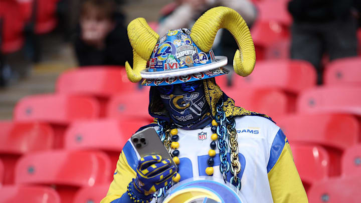 [US, Mexico & Canada customers only] Oct 19, 2025; London, United Kingdom; [US, Mexico & Canada customers only] Oct 19, 2025; London, England; Los Angeles Rams fan looks at their phone before a NFL International Series game between the Los Angeles Rams and the Jacksonville Jaguars at Wembley Stadium. Mandatory Credit: Andrew Boyers-Reuters via Imagn Images