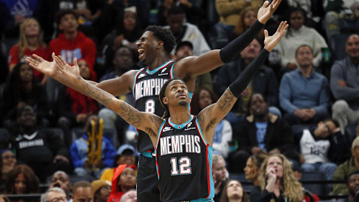 Nov 9, 2025; Memphis, Tennessee, USA; Memphis Grizzlies forward/center Jaren Jackson Jr. (8) and guard Ja Morant (12) react during the third quarter against the Oklahoma City Thunder at FedExForum. Mandatory Credit: Petre Thomas-Imagn Images