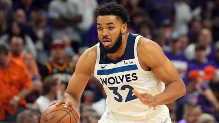 Apr 26, 2024; Phoenix, Arizona, USA; Minnesota Timberwolves center Karl-Anthony Towns (32) dribbles against the Phoenix Suns during the first half of game three of the first round for the 2024 NBA playoffs at Footprint Center. Mandatory Credit: Joe Camporeale-Imagn Images