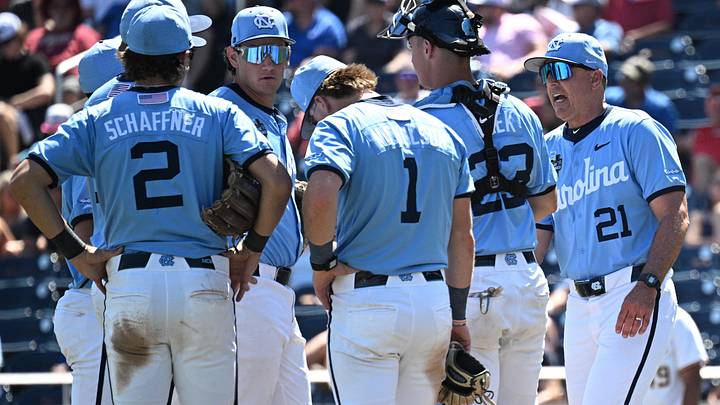 Jun 17, 2026; Omaha, NE, USA; North Carolina Tar Heels head coach Scott Forbes talks on the mound against the West Virginia Mountaineers during the seventh inning at Charles Schwab Field. Mandatory Credit: Steven Branscombe-Imagn Images Jun 17, 2026; Omaha, NE, USA; North Carolina Tar Heels head coach Scott Forbes talks on the mound against the West Virginia Mountaineers during the seventh inning at Charles Schwab Field. Mandatory Credit: Steven Branscombe-Imagn Images
