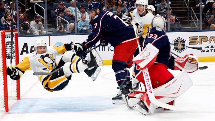 Oct 9, 2026; Columbus, Ohio, USA;  Pittsburgh Penguins center Blake Lizotte (46) falls to the ice after a check from Columbus Blue Jackets defenseman Carson Soucy (7) during the second period at Nationwide Arena.  Mandatory Credit: Russell LaBounty-Imagn Images