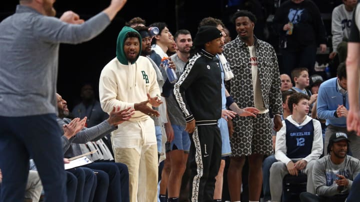 Mar 2, 2024; Memphis, Tennessee, USA; Memphis Grizzlies guard Marcus Smart (left), guard Ja Morant (middle) and forward-center Jaren Jackson Jr. (right) react from the bench during the first half against the Portland Trail Blazers at FedExForum. Mandatory Credit: Petre Thomas-USA TODAY Sports Mar 2, 2024; Memphis, Tennessee, USA; Memphis Grizzlies guard Marcus Smart (left), guard Ja Morant (middle) and forward-center Jaren Jackson Jr. (right) react from the bench during the first half against the Portland Trail Blazers at FedExForum. Mandatory Credit: Petre Thomas-USA TODAY Sports