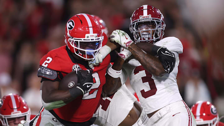 Sep 27, 2025; Athens, Georgia, USA;  Georgia Bulldogs running back Josh McCray (2) runs against Alabama Crimson Tide linebacker Nikhai Hill-Green (41) and defensive back Keon Sabb (3) in the second half at Sanford Stadium. Mandatory Credit: Brett Davis-Imagn Images