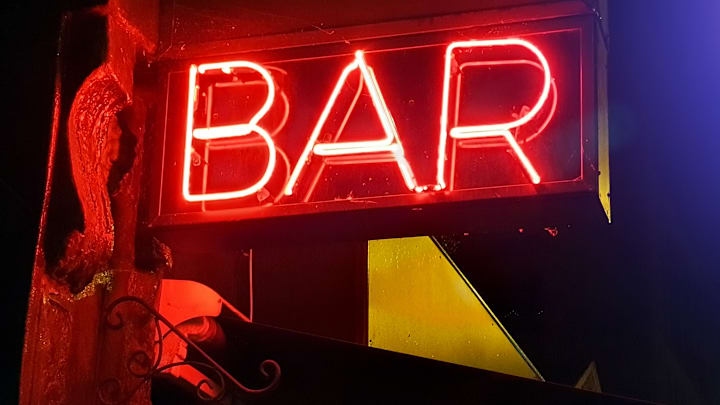 One indication you're in a dive bar: a neon sign.