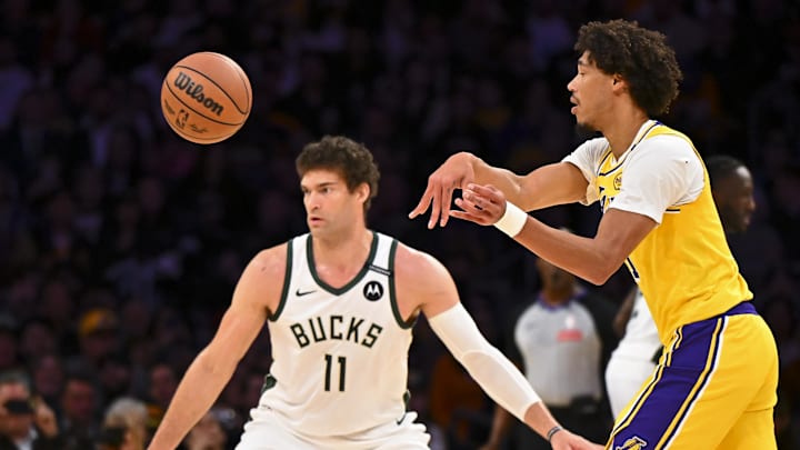 Los Angeles Lakers center Jaxson Hayes passes against Milwaukee Bucks center Brook Lopez during the first half at Crypto.com Arena on March 20.