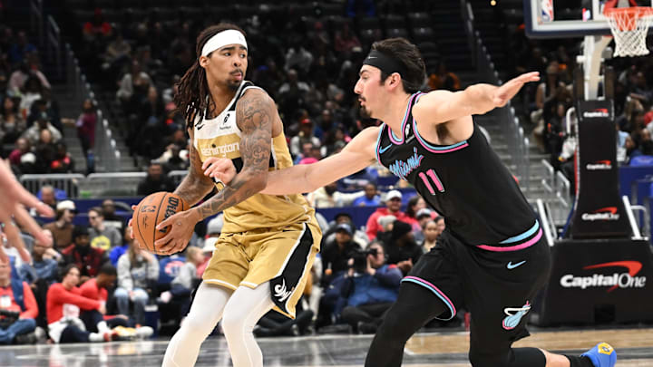 Feb 8, 2026; Washington, District of Columbia, USA; Washington Wizards guard Keshon Gilbert (55) keeps the ball away from Miami Heat forward Jaime Jaquez Jr. (11) during the third quarter at Capital One Arena. Mandatory Credit: Rafael Suanes-Imagn Images Feb 8, 2026; Washington, District of Columbia, USA; Washington Wizards guard Keshon Gilbert (55) keeps the ball away from Miami Heat forward Jaime Jaquez Jr. (11) during the third quarter at Capital One Arena. Mandatory Credit: Rafael Suanes-Imagn Images