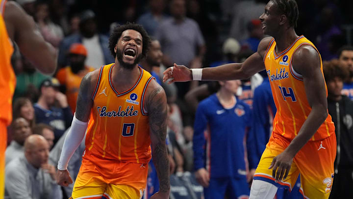 Mar 26, 2026; Charlotte, North Carolina, USA;  Charlotte Hornets forward Miles Bridges (0) and forward Moussa Diabaté (14) react after a score against the New York Knicks during the second half at the Spectrum Center. Mandatory Credit: Jim Dedmon-Imagn Images