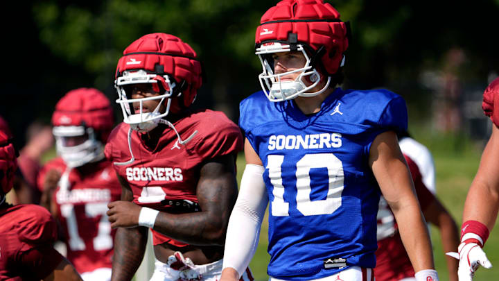 Oklahoma quarterback John Mateer stretches before one of the Sooners' fall camp practices.