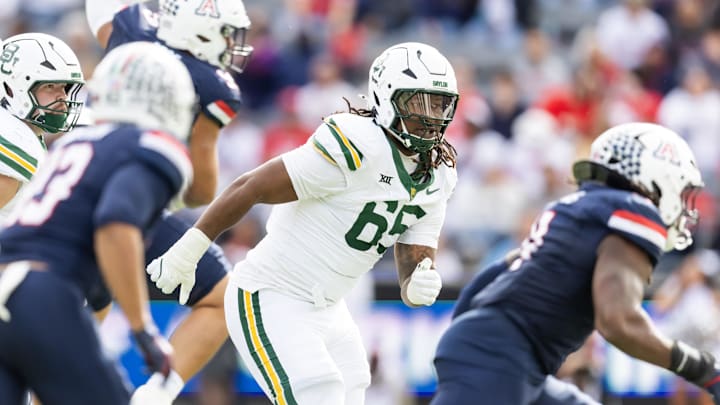 Nov 22, 2025; Tucson, Arizona, USA; Baylor Bears offensive lineman Sean Thompkins (65) against the Arizona Wildcats at Casino Del Sol Stadium. Mandatory Credit: Mark J. Rebilas-Imagn Images