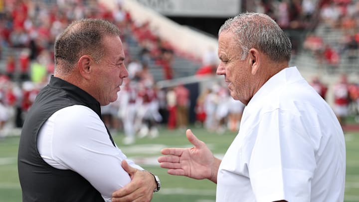 Little Rock, Arkansas, USA; Arkansas State Red Wolves head coach Butch Jones talks to Arkansas Razorbacks head coach Sam Pittman prior to the game at War Memorial Stadium.