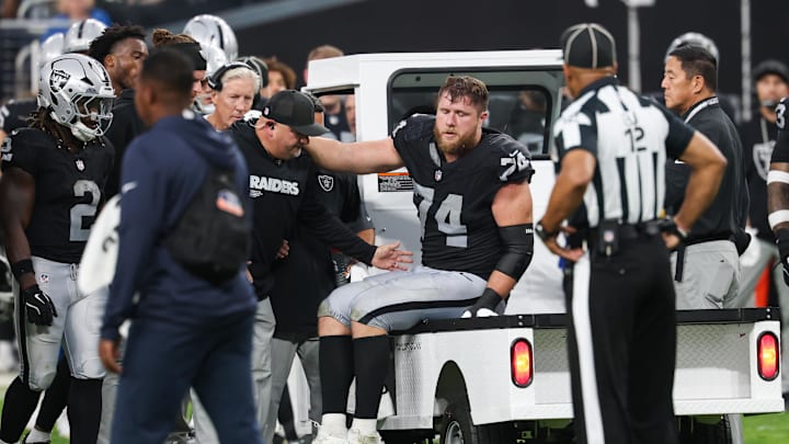 Sep 28, 2025; Paradise, Nevada, USA; Las Vegas Raiders offensive tackle Kolton Miller (74) is loaded onto the medical cart during the second half against the Chicago Bears at Allegiant Stadium. Mandatory Credit: Kiyoshi Mio-Imagn Images