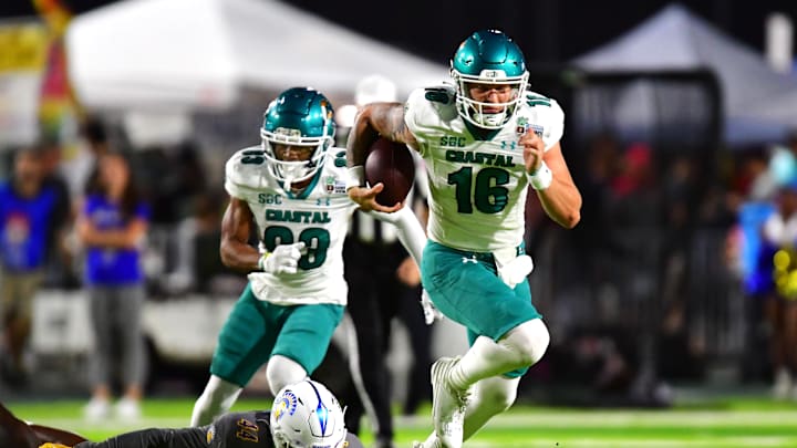 Dec 23, 2023; Honolulu, HI, USA; Coastal Carolina Chanticleers quarterback Ethan Vasko (16) runs the ball against the San Jose State Spartans during the second quarter of the Easypost Hawaii Bowl at Clarence T.C. Ching Athletics Complex. Mandatory Credit: Steven Erler-Imagn Images