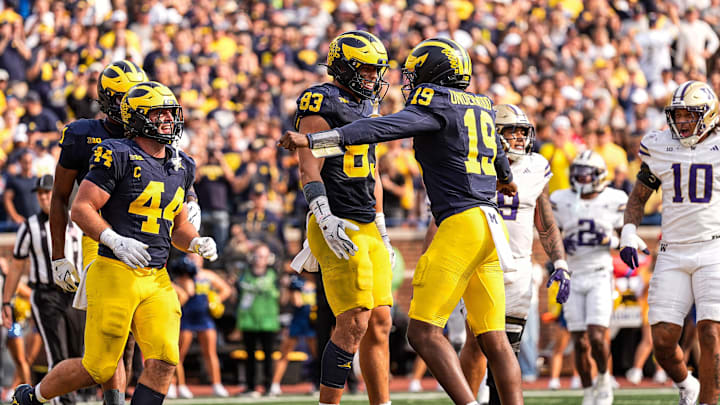 Michigan tight end Zack Marshall (83) celebrates a touchdown against Washington with quarterback Bryce Underwood (19) during the second half at Michigan Stadium in Ann Arbor on Saturday, Oct. 18, 2025.