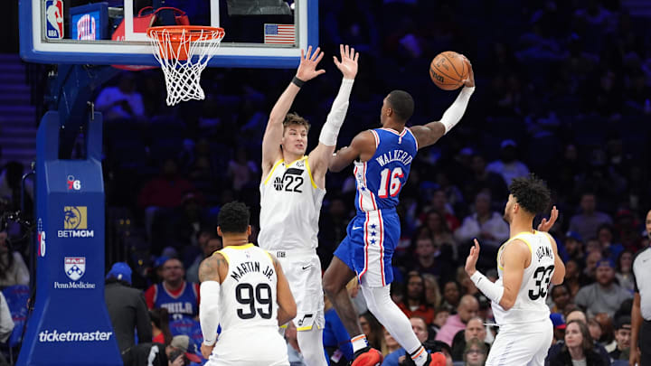 Mar 9, 2025; Philadelphia, Pennsylvania, USA; Philadelphia 76ers guard Lonnie Walker IV (16) drives to shoot against Utah Jazz center Kyle Filipowski (22) in the third quarter at Wells Fargo Center. Mandatory Credit: Kyle Ross-Imagn Images Mar 9, 2025; Philadelphia, Pennsylvania, USA; Philadelphia 76ers guard Lonnie Walker IV (16) drives to shoot against Utah Jazz center Kyle Filipowski (22) in the third quarter at Wells Fargo Center. Mandatory Credit: Kyle Ross-Imagn Images
