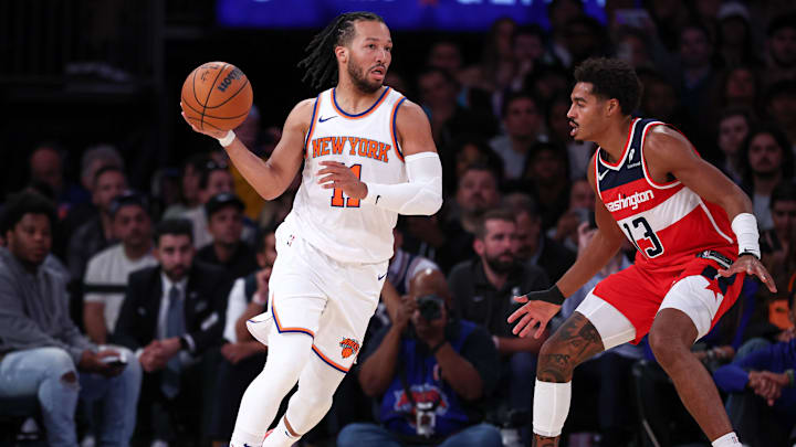 Oct 9, 2024; New York, New York, USA; New York Knicks guard Jalen Brunson (11) dribbles as Washington Wizards guard Jordan Poole (13) defends during the first half at Madison Square Garden. Mandatory Credit: Vincent Carchietta-Imagn Images