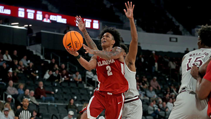 Jan 13, 2026; Starkville, Mississippi, USA; Alabama Crimson Tide guard Aden Holloway (2) shoots during the second half against the Mississippi State Bulldogs at Humphrey Coliseum. Mandatory Credit: Petre Thomas-Imagn Images