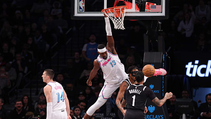 Feb 7, 2025; Brooklyn, New York, USA; Miami Heat center Bam Adebayo (13) hangs on the rim after dunking the ball against the Brooklyn Nets during the first quarter at Barclays Center. Mandatory Credit: Vincent Carchietta-Imagn Images Feb 7, 2025; Brooklyn, New York, USA; Miami Heat center Bam Adebayo (13) hangs on the rim after dunking the ball against the Brooklyn Nets during the first quarter at Barclays Center. Mandatory Credit: Vincent Carchietta-Imagn Images