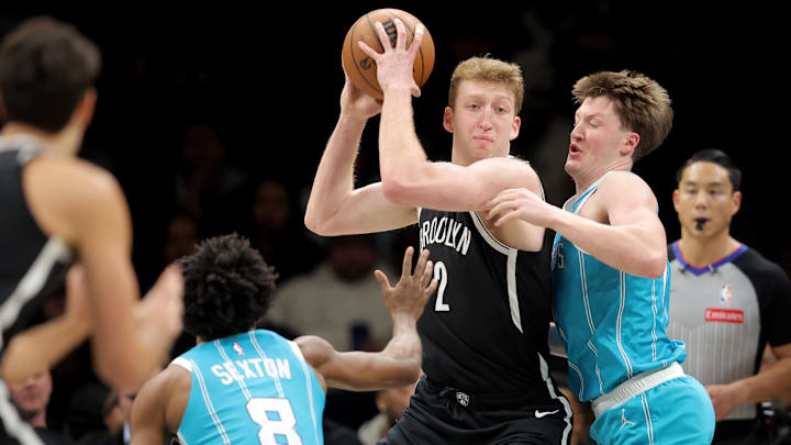 Dec 1, 2025; Brooklyn, New York, USA; Brooklyn Nets forward Danny Wolf (2) looks to pass the ball against Charlotte Hornets guards Kon Knueppel (7) and Collin Sexton (8) during the first quarter at Barclays Center. Mandatory Credit: Brad Penner-Imagn Images Dec 1, 2025; Brooklyn, New York, USA; Brooklyn Nets forward Danny Wolf (2) looks to pass the ball against Charlotte Hornets guards Kon Knueppel (7) and Collin Sexton (8) during the first quarter at Barclays Center. Mandatory Credit: Brad Penner-Imagn Images