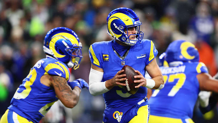 Dec 18, 2025; Seattle, Washington, USA; Los Angeles Rams quarterback Matthew Stafford (9) looks to pass against the Seattle Seahawks in the first half at Lumen Field. Mandatory Credit: Kevin Ng-Imagn Images