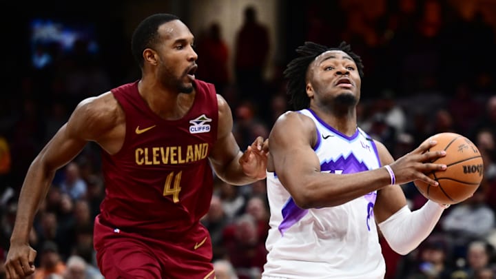 Jan 12, 2026; Cleveland, Ohio, USA; Utah Jazz guard Isaiah Collier (8) drives to the basket against Cleveland Cavaliers center Evan Mobley (4) during the second half at Rocket Arena. Mandatory Credit: Ken Blaze-Imagn Images