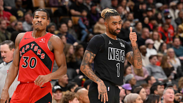 Jan 1, 2025; Toronto, Ontario, CAN; Brooklyn Nets guard D'Angelo Russell (1) reacts to an official's call as Toronto Raptors guard Ochai Agbaji (30) looks on in the second half at Scotiabank Arena. Mandatory Credit: Dan Hamilton-Imagn Images Jan 1, 2025; Toronto, Ontario, CAN; Brooklyn Nets guard D'Angelo Russell (1) reacts to an official's call as Toronto Raptors guard Ochai Agbaji (30) looks on in the second half at Scotiabank Arena. Mandatory Credit: Dan Hamilton-Imagn Images