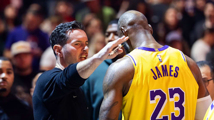 Dec 23, 2025; Phoenix, Arizona, USA; Los Angeles Lakers forward LeBron James (23) and head coach JJ Redick against the Phoenix Suns at Mortgage Matchup Center. Mandatory Credit: Mark J. Rebilas-Imagn Images