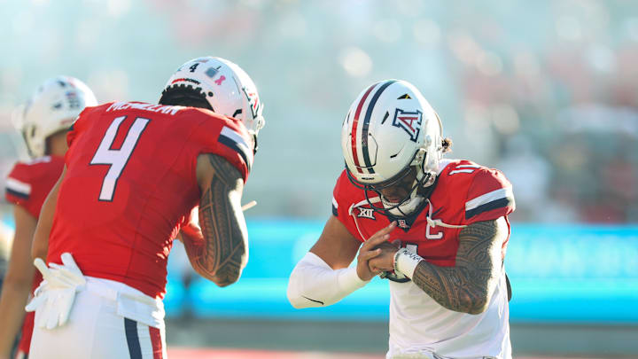 Oct 26, 2024; Tucson, Arizona, USA; Arizona Wildcats quarterback Noah Fifita (11) does handshake with Arizona Wildcats wide receiver Tetairoa McMillan (4) before the game against West Virginia Mountaineers at Arizona Stadium. Mandatory Credit: Aryanna Frank-Imagn Images