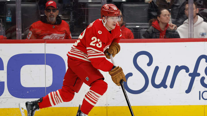 Apr 11, 2026; Detroit, Michigan, USA;  Detroit Red Wings left wing Lucas Raymond (23) skates with the puck in the first period against the New Jersey Devils at Little Caesars Arena. Mandatory Credit: Rick Osentoski-Imagn Images