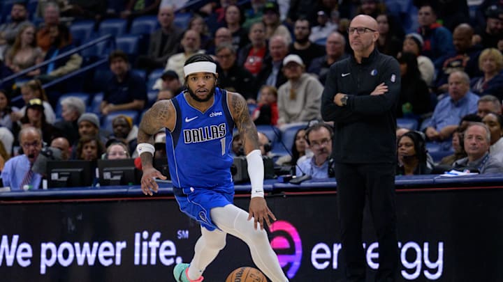 Jan 15, 2025; New Orleans, Louisiana, USA;  Dallas Mavericks guard Jaden Hardy (1) dribbles past head coach Jason Kidd during the first half against the Dallas Mavericks at Smoothie King Center. Mandatory Credit: Matthew Hinton-Imagn Images