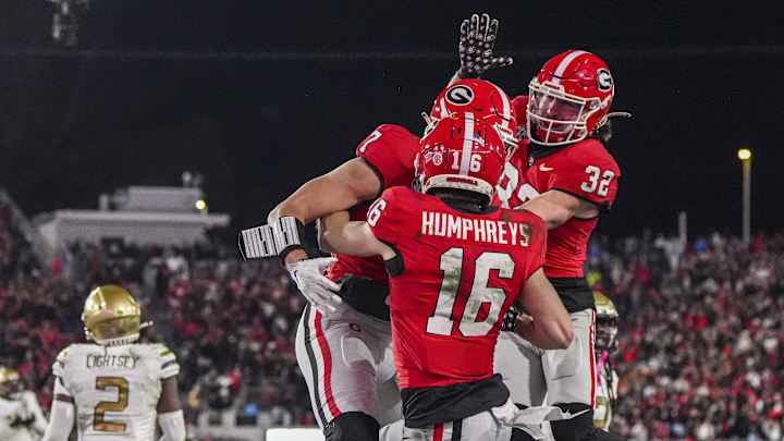 Nov 29, 2024; Athens, Georgia, USA; Georgia Bulldogs wide receiver London Humphreys (16) reacts with tight end Lawson Luckie (7) and running back Cash Jones (32) after scoring a touchdown against the Georgia Tech Yellow Jackets during overtime at Sanford Stadium. Mandatory Credit: Dale Zanine-Imagn Images Nov 29, 2024; Athens, Georgia, USA; Georgia Bulldogs wide receiver London Humphreys (16) reacts with tight end Lawson Luckie (7) and running back Cash Jones (32) after scoring a touchdown against the Georgia Tech Yellow Jackets during overtime at Sanford Stadium. Mandatory Credit: Dale Zanine-Imagn Images