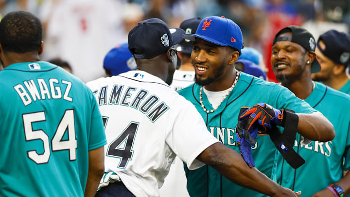Cleveland Cavaliers guard Donovan Mitchell greets former Seattle Mariners outfielder Mike Cameron following the All Star-Celebrity Softball Game at T-Mobile Park on July 8, 2023.