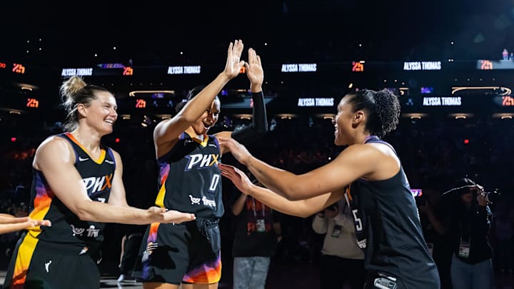 Jun 11, 2025; Phoenix, Arizona, USA; Phoenix Mercury forward Alyssa Thomas (25) with forward Satou Sabally (0) and guard Sami Whitcomb (33) against the Dallas Wings at PHX Arena. Mandatory Credit: Mark J. Rebilas-Imagn Images