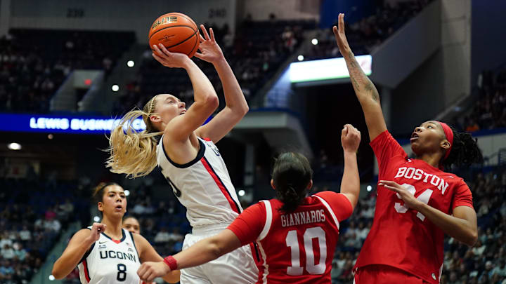 Nov 7, 2024; Storrs, Connecticut, USA; UConn Huskies guard Paige Bueckers (5) shoots against Boston University Terriers guard Alex Giannaros (10) in the first half at Harry A. Gampel Pavilion. Mandatory Credit: David Butler II-Imagn Images