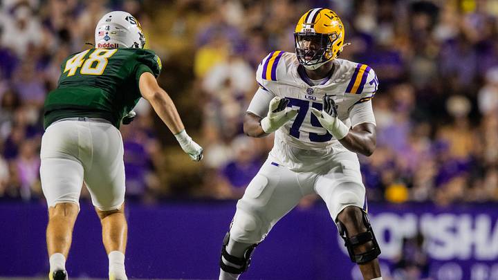 Sep 20, 2025; Baton Rouge, Louisiana, USA; LSU Tigers offensive tackle Weston Davis (75) blocks Southeastern Louisiana Lions defensive lineman Max Elkman (48) during the first half at Tiger Stadium. Mandatory Credit: Stephen Lew-Imagn Images Sep 20, 2025; Baton Rouge, Louisiana, USA; LSU Tigers offensive tackle Weston Davis (75) blocks Southeastern Louisiana Lions defensive lineman Max Elkman (48) during the first half at Tiger Stadium. Mandatory Credit: Stephen Lew-Imagn Images