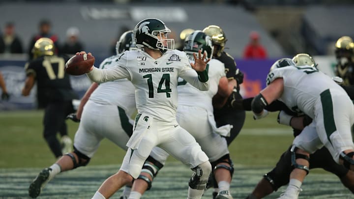 Dec 27, 2019; Bronx, New York, USA; Michigan State quarterback Brian Lewerke (14) throws a pass