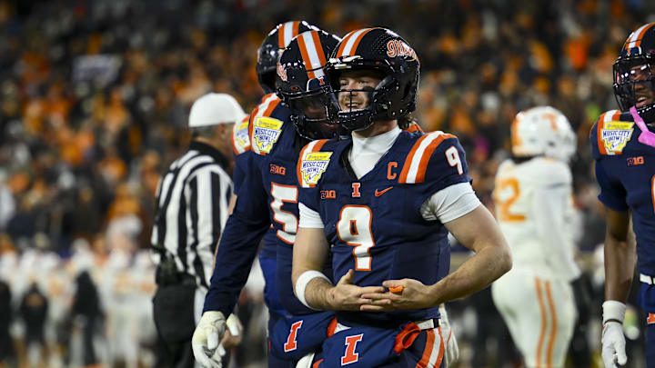 Dec 30, 2025; Nashville, TN, USA; Illinois Fighting Illini quarterback Luke Altmyer (9) celebrates his touchdown against the Tennessee Volunteers during the second half at Nissan Stadium. Mandatory Credit: Steve Roberts-Imagn Images