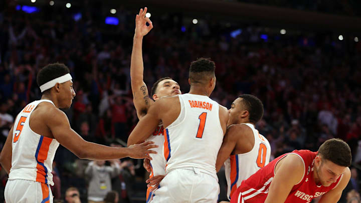 Mar 24, 2017; New York, NY, USA; Florida Gators guard Chris Chiozza (11) celebrates making the game winning shot against the Wisconsin Badgers in the semifinals of the East Regional of the 2017 NCAA Tournament at Madison Square Garden. Mandatory Credit: Brad Penner-Imagn Images