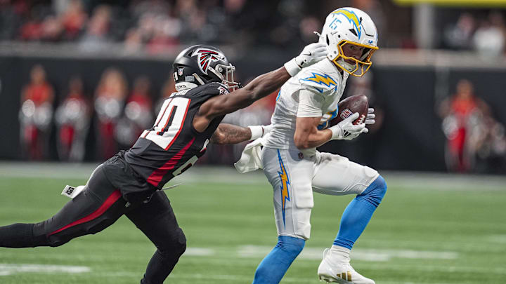 Dec 1, 2024; Atlanta, Georgia, USA; Los Angeles Chargers wide receiver Ladd McConkey (15) makes a catch against Atlanta Falcons cornerback Dee Alford (20) during the first half at Mercedes-Benz Stadium. Mandatory Credit: Dale Zanine-Imagn Images