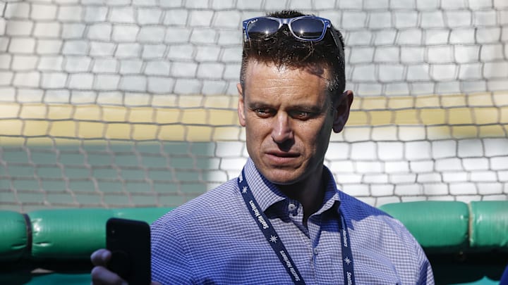 Seattle Mariners general manager Jerry Dipoto checks his phone.