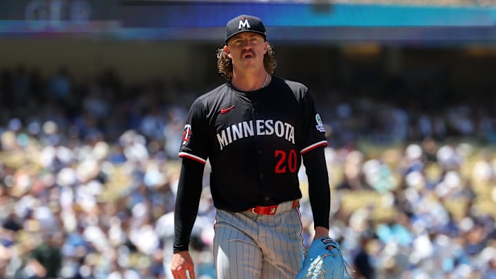 Jul 23, 2025; Los Angeles, California, USA;  Minnesota Twins starting pitcher Chris Paddack (20) walks back to the dugout after pitching sixth inning against the Los Angeles Dodgers at Dodger Stadium. Mandatory Credit: Kiyoshi Mio-Imagn Images