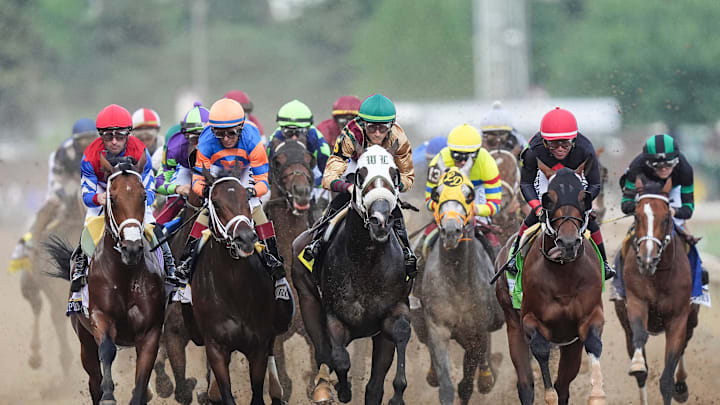 The field of 20 of the 2024 Kentucky Derby enter the first turn during the 150th Run For the Roses at Churchill Downs Saturday, May 4, 2024, in Louisville, Ky.