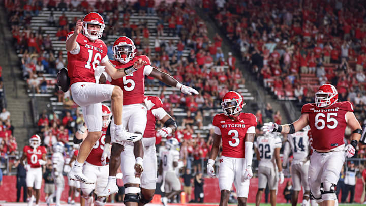 Aug 29, 2024; Piscataway, New Jersey, USA;  Rutgers Scarlet Knights running back Kyle Monangai (5) and quarterback Athan Kaliakmanis (16) celebrate after a touchdown during the second half against the Howard Bison at SHI Stadium. Mandatory Credit: Vincent Carchietta-Imagn Images