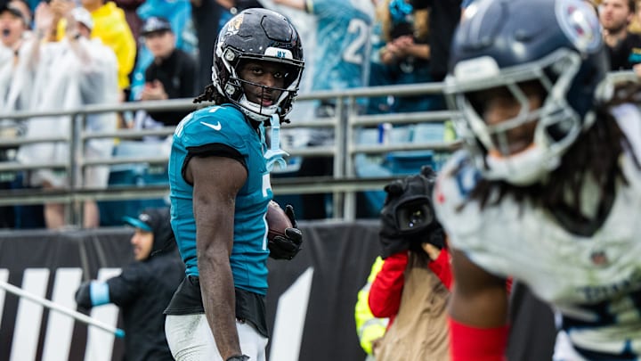 Dec 29, 2024; Jacksonville, Florida, USA; Jacksonville Jaguars wide receiver Brian Thomas Jr (7) celebrates a touchdown against the Tennessee Titans in the fourth quarter at EverBank Stadium. Mandatory Credit: Jeremy Reper-Imagn Images