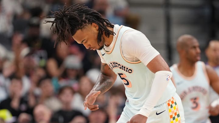 Apr 13, 2025; San Antonio, Texas, USA; San Antonio Spurs guard Stephon Castle (5) reacts after scoring a three point basket during the first half against the Toronto Raptors at Frost Bank Center. Mandatory Credit: Scott Wachter-Imagn Images